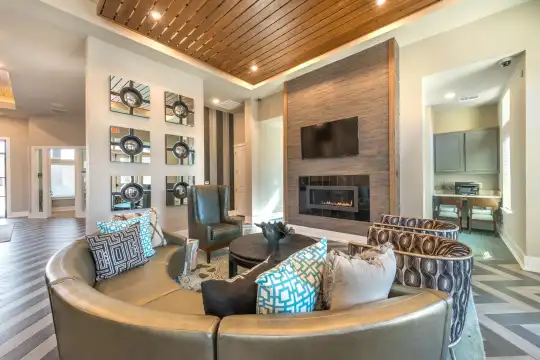 living room featuring hardwood floors, a fireplace, and TV