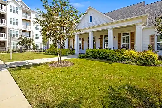 neoclassical / greek revival house with a large front lawn