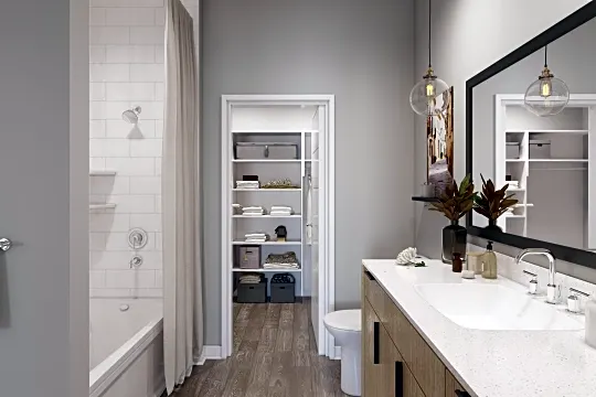 full bathroom featuring parquet floors, mirror, vanity, toilet, shower / washtub combination, and shower curtain