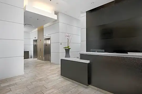 reception featuring tile flooring and an elevator