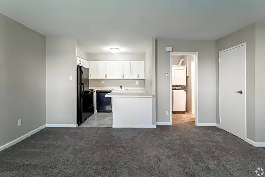 living room with carpet and refrigerator