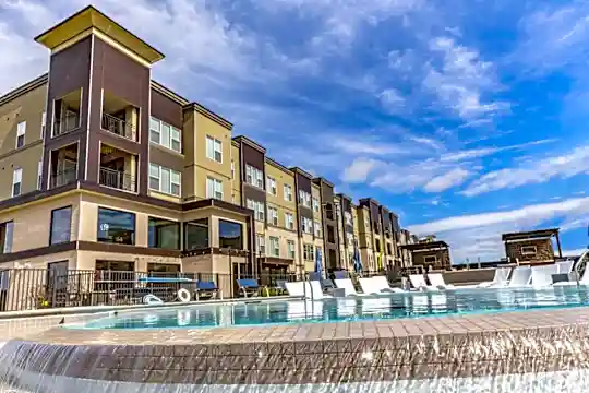 view of building exterior featuring a swimming pool