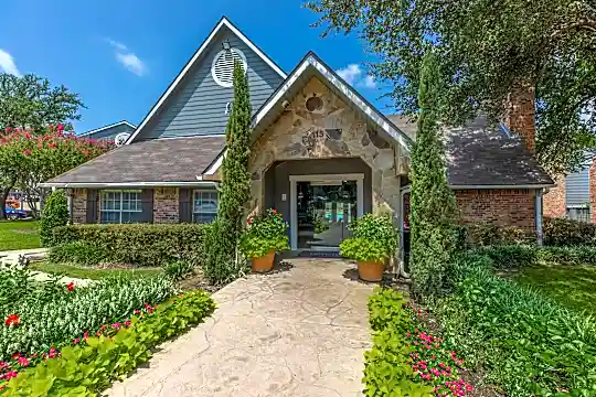 tudor-style house with a front yard