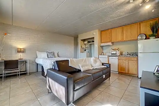 tiled living room with refrigerator, extractor fan, dishwasher, and microwave