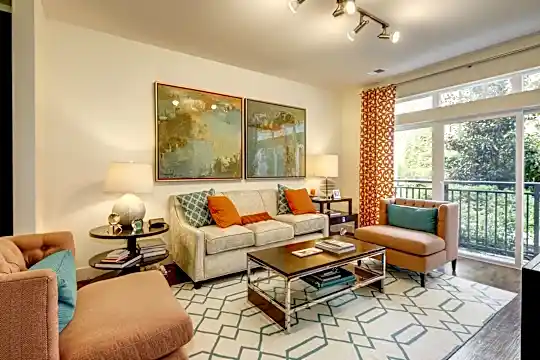 living room featuring a healthy amount of sunlight and parquet floors