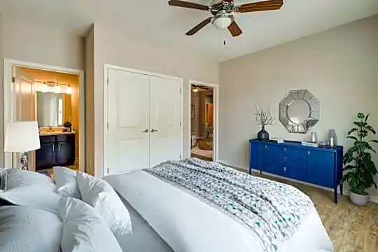hardwood floored bedroom featuring a ceiling fan