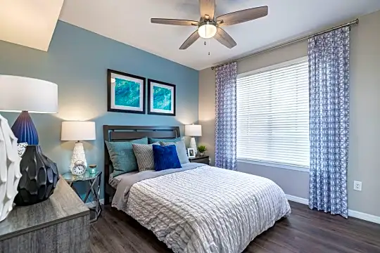 bedroom featuring a ceiling fan and natural light