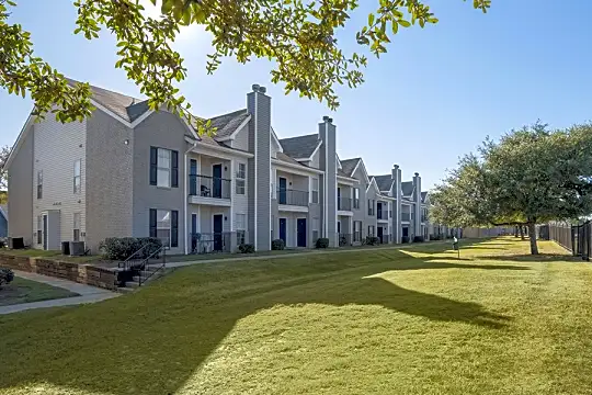 view of home's community with a large lawn