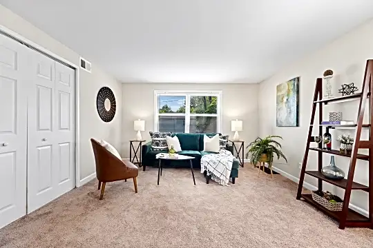 living area with carpet and natural light