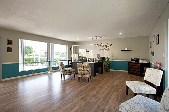 hardwood floored living room featuring natural light