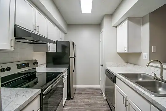 kitchen with refrigerator, electric range oven, range hood, stainless steel dishwasher, light hardwood floors, white cabinetry, and light granite-like countertops
