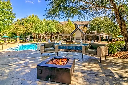 view of swimming pool featuring fire pit
