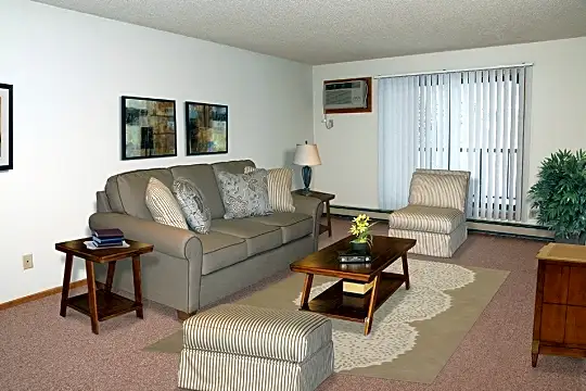 living room featuring carpet and baseboard radiator