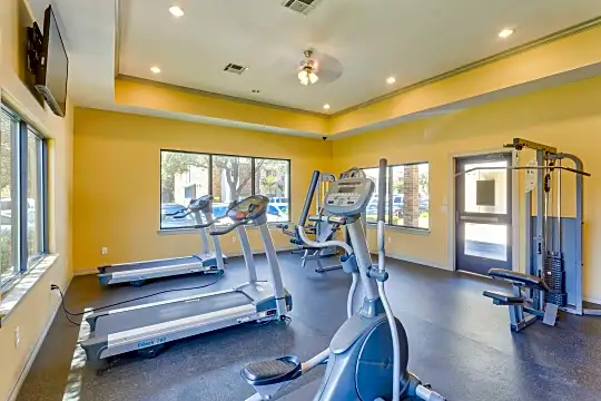 workout area featuring a wealth of natural light and TV