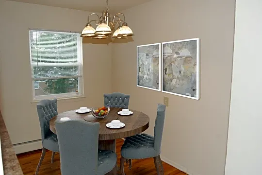 dining room with natural light and baseboard radiator