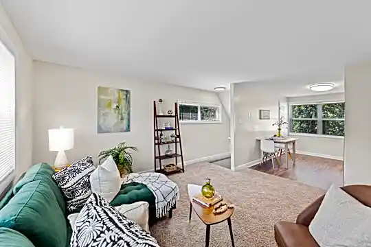 living room featuring carpet and natural light