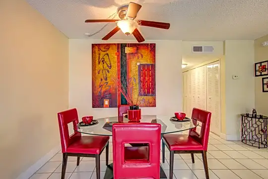 dining area featuring a ceiling fan and tile flooring