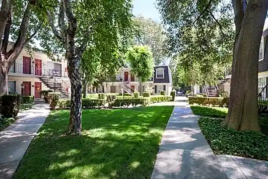 view of home's community with a yard
