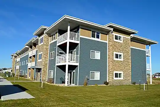 view of building exterior with a lawn