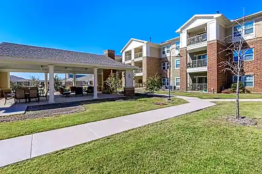 view of property with a large lawn