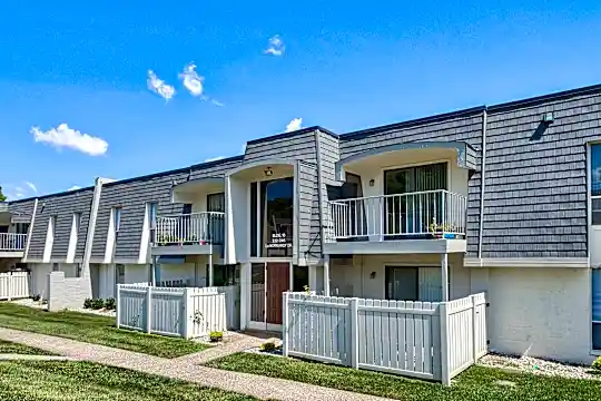 back of property with a yard