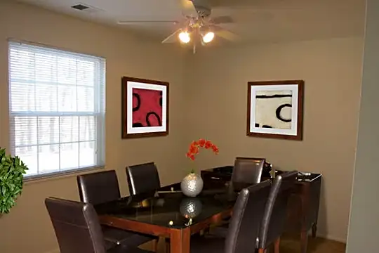 dining room with a ceiling fan, carpet, and natural light