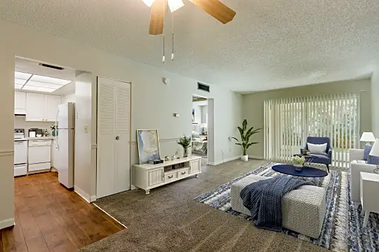 bedroom with a ceiling fan, carpet, and refrigerator