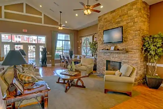 living room with hardwood flooring, a fireplace, lofted ceiling, natural light, a ceiling fan, and TV