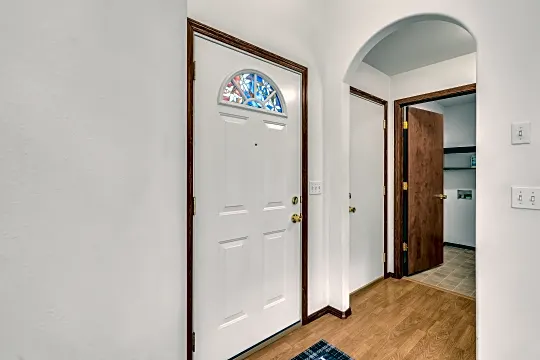 8168 N Ainsworth Dr - Front Door With Stained Glass.png