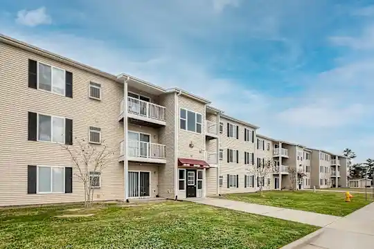Modern apartment building exterior with professional landscaping