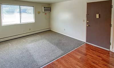 hardwood floored spare room featuring natural light and baseboard radiator, Valentine Gardens, 2