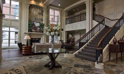building lobby featuring natural light, a high ceiling, and a fireplace, Brewers Yard Apartments, 1