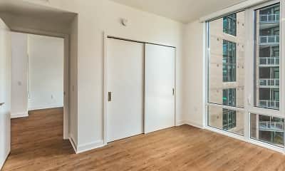 bedroom with hardwood floors and a wealth of natural light, 100K, 2