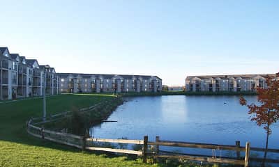 water view featuring a large lawn and a dock, Oak Shores Apartments, 1