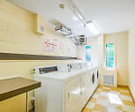 laundry area featuring plenty of natural light, tile floors, and washer / dryer, West Wood Oaks
