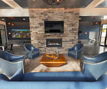 building lobby with a fireplace, natural light, and TV, The Tannery