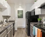 kitchen featuring electric range oven, baseboard radiator, range hood, dishwasher, white cabinets, light hardwood floors, and dark stone countertops, Habitat at Fort Collins