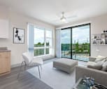 living room with a wealth of natural light, a ceiling fan, and hardwood floors, The Lofts at South Lake