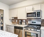 kitchen featuring stainless steel appliances, gas range oven, light granite-like countertops, and white cabinets, The Kenmore