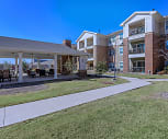 view of property with a large lawn, Mariposa Apartment Homes at Spring Hollow (Senior Living 55+)