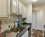 kitchen with range oven, stainless steel dishwasher, white cabinets, granite-like countertops, and dark hardwood flooring, The Ashby At Mclean
