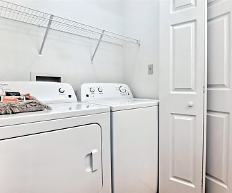 clothes washing area featuring independent washer and dryer, Village Woods Apartments