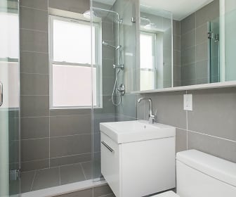 bathroom featuring natural light, a shower, toilet, mirror, and vanity, 136 Highland Avenue