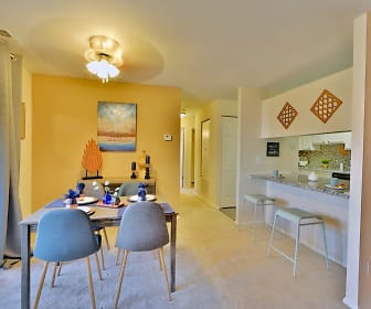 carpeted dining area featuring a kitchen bar, Silver Spring Station Apartment Homes