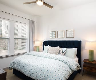 bedroom featuring a wealth of natural light and a ceiling fan, Lux on Main