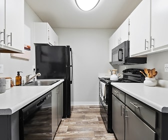 kitchen featuring refrigerator, electric range oven, dishwasher, microwave, dark flooring, dark brown cabinets, and light stone countertops, ReNew One59