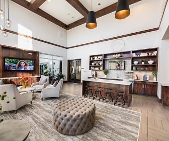 building lobby featuring a kitchen bar, wood beam ceiling, tile floors, and TV, Centro