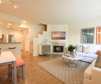 hardwood floored living room with a fireplace, refrigerator, and TV, Newport Bluffs