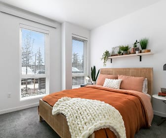 carpeted bedroom featuring multiple windows, Alta Civic Station