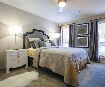 carpeted bedroom featuring multiple windows and a ceiling fan, Cortland at the Village